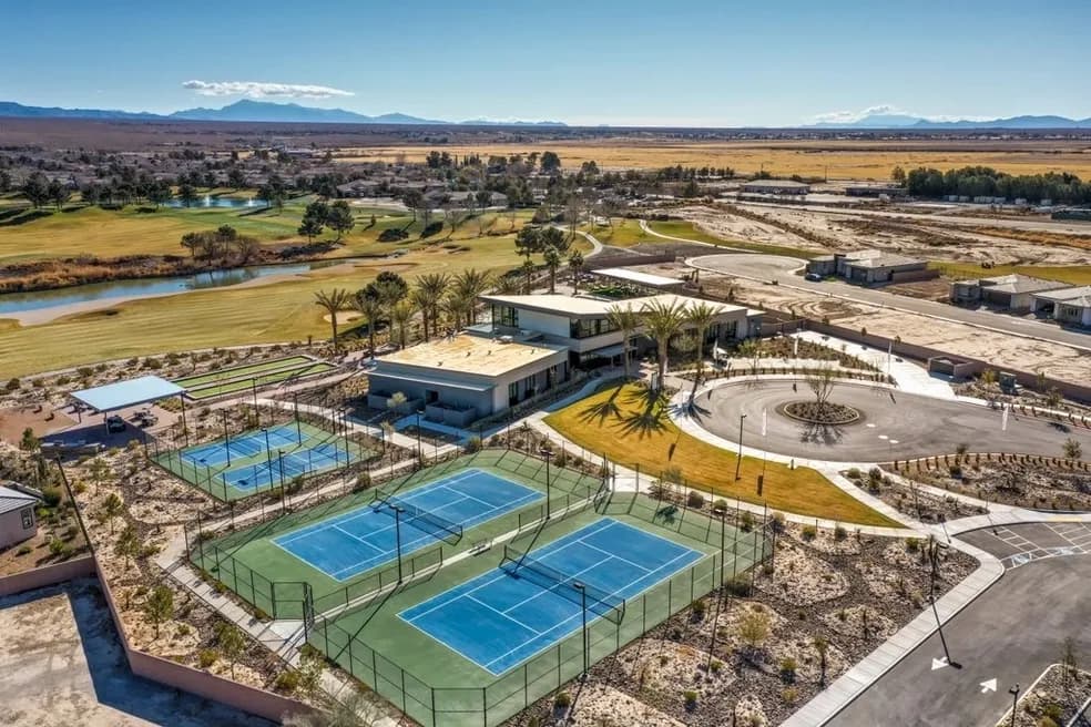 Aerial overview of the community center, tennis courts, and amenities
